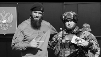 Combattants tchétchènes de l’unité Akhmat lors d’une cérémonie de remise de distinctions militaires aux abords de la ligne de front.